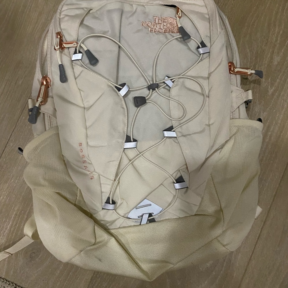 North Face cream and rose gold detail backpack